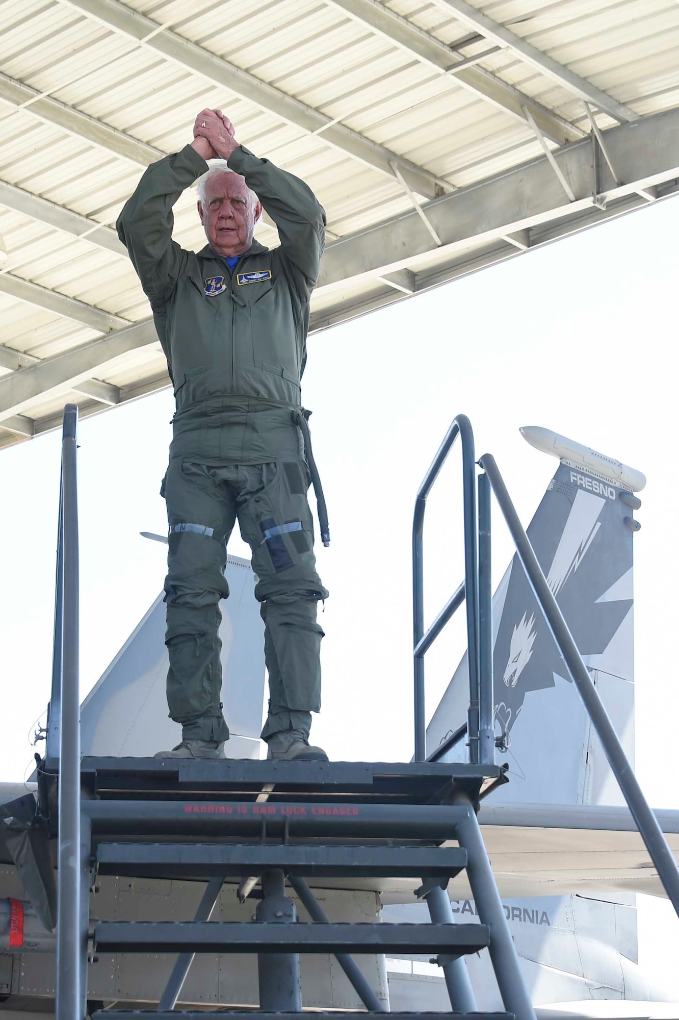 U.S. Air Force Brig. Gen. (ret.) Robert Earthquake Titus steps off of a 144th Fighter Wing F-15D Eagle at the Fresno Air National Guard Base, April 1, 2016. Titus is the 144th Fighter Wing's 3rd Annual Heritage Week honored guest, who had the opportunity to sit in the cockpit of an F-15 and also shared his personal experiences as a fighter pilot with the 144th FW Airmen. (U.S. Air National Guard photo by Senior Airman Klynne Pearl Serrano)