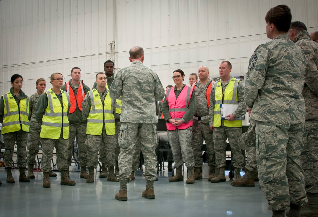 Maj. Gen. Donald P. Dunbar, the Wisconsin Adjutant General, observes and visits with Airmen at the 128th Air Refueling Wing, Wisconsin Air National Guard, as they exercise their personnel deployment function duties here April 3, 2016. The personnel deployment function is organized to ensure Airmen are accounted for and prepared to rapidly deploy worldwide. (U.S. Air Force photo by Senior Airman Morgan R. Lipinski/Released)
