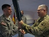 Lt. Col. Edward W. Van Giezen, incoming commander of the 7th Intermediate Level Education Detachment, receives the unit’s colors from Kevin M. Sanders, the deputy commanding officer of the 7th Mission Support Command, Saturday, April 2, 2016 during the change of command ceremony. (Photo by Chaplain Lt. Col. Brian Harki, 7th Mission Support Command)