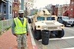 Pvt. 1st Class Ayuk Orock, a culinary specialist with the 547th Transportation Company, District of Columbia Army National Guard, monitors vehicle and pedestrian traffic at a busy intersection in downtown Washington, D.C., in support of the 2016 Nuclear Security Summit held at the Walter E. Washington Convention Center, March 31 and April 1, 2016. 