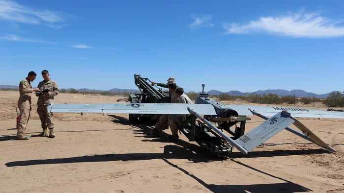 Marines with Marine Unmanned Aerial Vehicle Squadron 1 perform function checks for the flight of the RQ-7Bv2 Shadow, an unmanned aerial system, at the Cannon Air Defense Complex in Yuma, Arizona, March 25, 2016. Marine Wing Support Squadron 371 and MWSS-274 supported VMU-1 by building a runway in preparation for the Shadow’s first flight at the site.