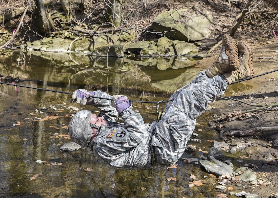 Medical students at the Uniformed Services University of the Health Sciences perform field exercise drills during Operation Gunpowder at Naval Support Activity Bethesda in Bethesda, Md., March 21, 2016. Navy photo by Airman Matthew Hobso