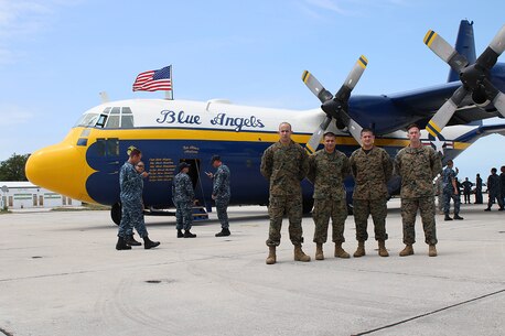 Marines from Recruiting Substation Perrine, Recruiting Station Fort Lauderdale pose in front of Fat Albert, a C-130 at the Southernmost Air Spectacular featuring the Navy and Marine Corps Blue Angels at Naval Air Station Key West Florida. (Photo by Sgt Michael Lopez, USMC)
