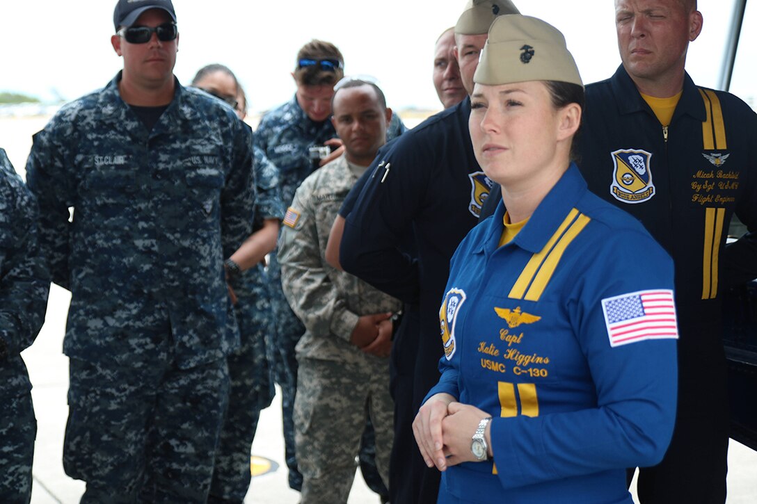 Marine Captain Katie Higgins gives her preflight brief to service members prior to letting them fly in Fat Albert, a C-130 Hercules, at the Southernmost Air Spectacular featuring the Navy and Marine Corps Blue Angels at Naval Air Station Key West Florida. Captain Higgins is the first female Blue Angels Pilot in history. (Photo by Sgt Michael Lopez, USMC)