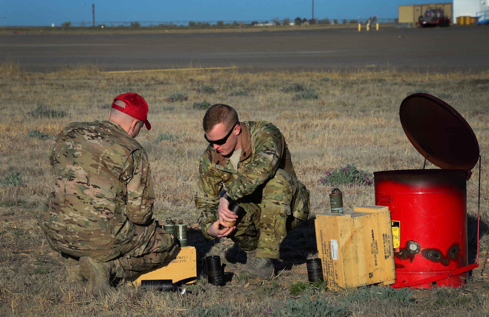 Team members with the 26th Special Tactics Squadron prepare a smoke signal system near a landing zone March 25, 2016, at Cannon Air Force Base, N.M. The smoke was used to help other 26th STS members performing routine practice jumps over the Cannon flightline. (U.S. Air Force photo/Staff Sgt. Alexx Pons) 