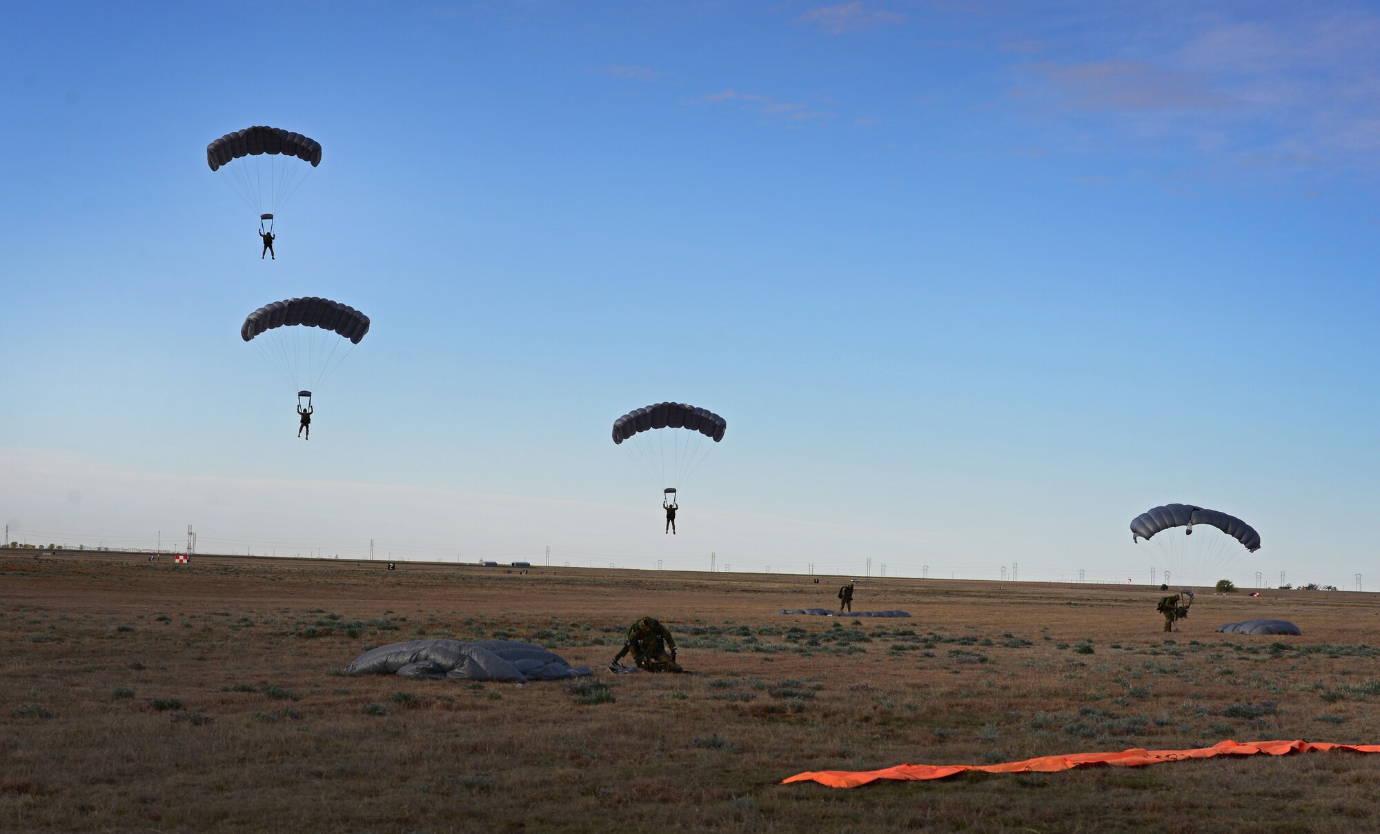Members with the 26th Special Tactics Squadron make their final decent onto a landing zone March 25, 2016, at Cannon Air Force Base, N.M. Air Commandos with the 26th STS performed routine practice jumps as part of maintaining operational readiness. (U.S. Air Force photo/Staff Sgt. Alexx Pons) 