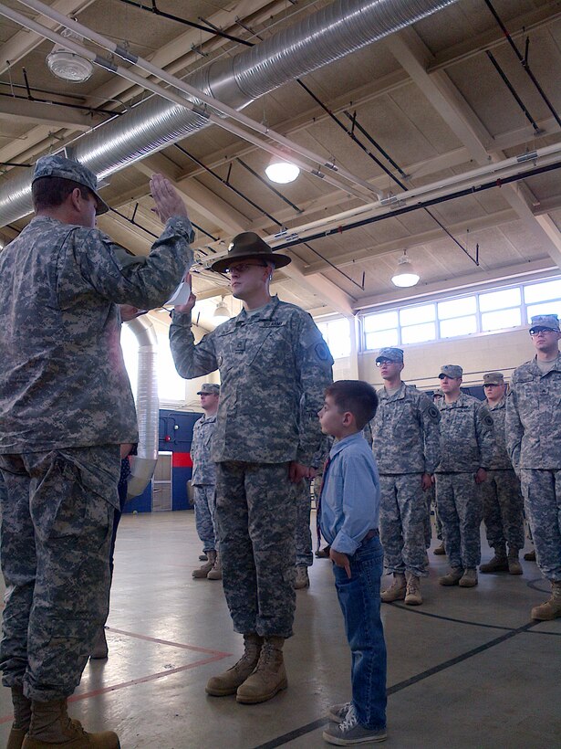 Lt. Col. Matthew Patterson, battalion commander, 3rd Brigade, 98th Training Division (Initial Entry Training), administers the Oath of Office to Staff Sgt. Craig Dowdy during his commissioning ceremony on Jan. 10, 2016.(Courtesy photo)