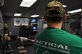 John Mikula observes his students training circuit February 25, 2016 at the Human Performance Center of Dobbins Air Reserve Base, Ga. The support of Mikula’s students really shows how effective his coaching skills are. The students come in before class and start their pre-class circuits at workout stations around the room. (U.S. Air Force photo by Senior Airman Lauren Douglas) 