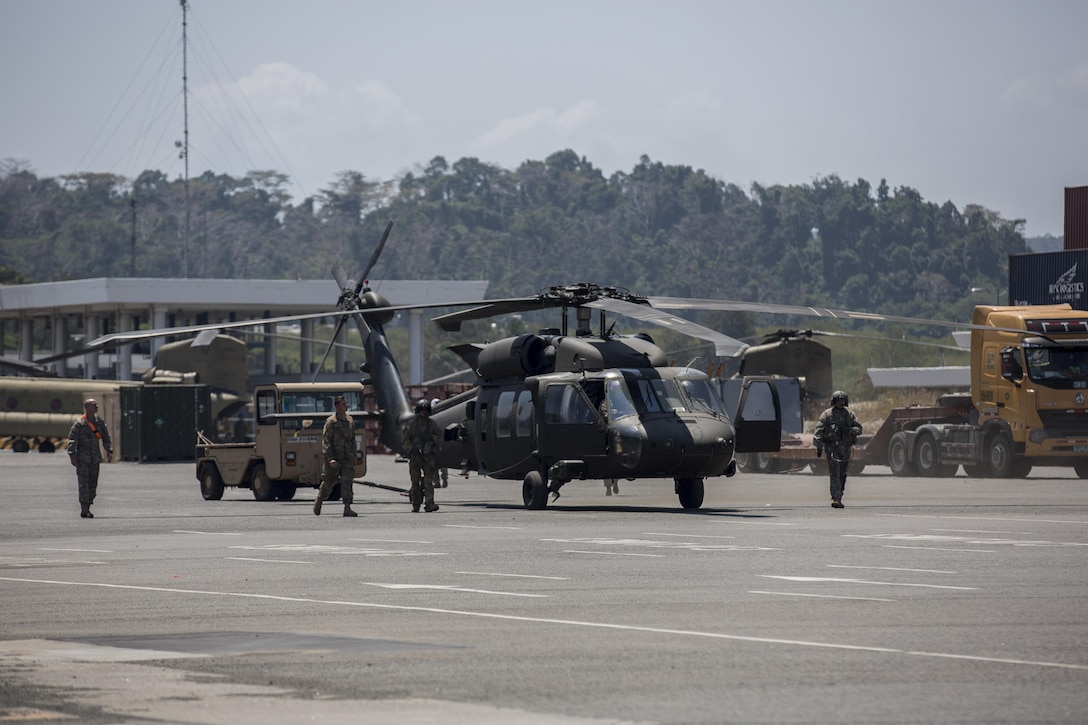 Soldiers prepare the a UH-60M Black Hawk for flight during Balikatan 2016 in Subic Bay, Philippines, April 3, 2016. The exercise strengthens interoperability and partner-nation capabilities for planning and executing military operations, and advancing regional security operations. Marine Corps photo by Lance Cpl. Damon A. Mclean