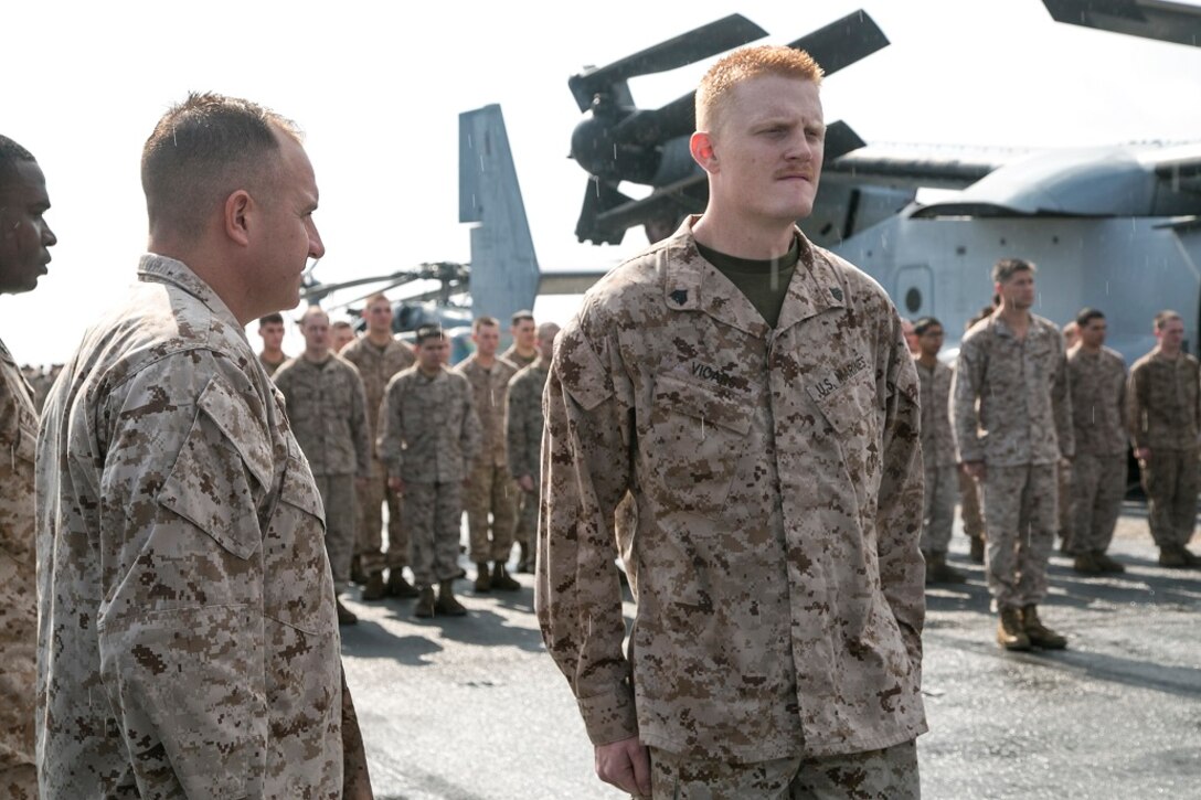 AT SEA (April 1, 2016)-U.S. Marine Sgt. Jordan Vicars with the 13th Marine Expeditionary Unit, receives a certificate of commendation during a promotion and awards ceremony, April 1, 2016, during the MEU's western pacific deployment aboard the USS Boxer. More then 4,500 Marines and Sailors from the Boxer ARG, 13th MEU team are currently transiting the Pacific Ocean toward the U.S. 5th fleet area of operations during a scheduled deployment. (U.S. Marine Corps photo by Sgt. Briauna Birl/RELEASED)
