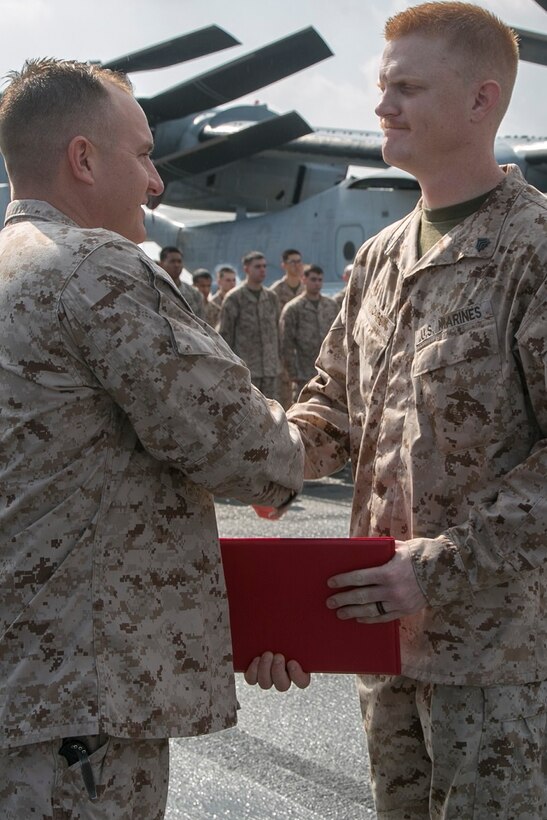AT SEA (April 1, 2016)-U.S. Marine Sgt. Jordan Vicars with the 13th Marine Expeditionary Unit, receives a certificate of commendation during a promotion and awards ceremony, April 1, 2016, during the MEU's western pacific deployment aboard the USS Boxer. More then 4,500 Marines and Sailors from the Boxer ARG, 13th MEU team are currently transiting the Pacific Ocean toward the U.S. 5th fleet area of operations during a scheduled deployment. (U.S. Marine Corps photo by Sgt. Briauna Birl/RELEASED)