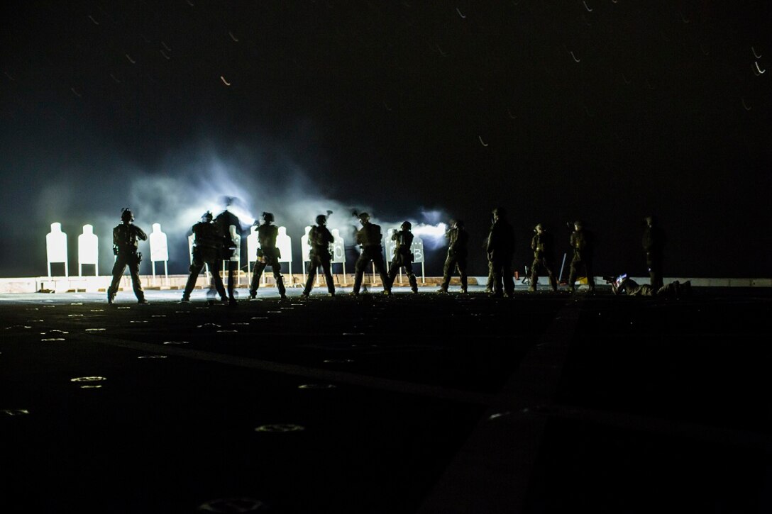 U.S. Marines with Maritime Raid Force, 13th Marine Expeditionary Unit, conduct a deck shoot at night during their Western Pacific Deployment 16 aboard the USS New Orleans, April 1, 2016. More then 4,500 Marines and Sailors from the Boxer ARG, 13th MEU team are currently transiting the Pacific Ocean toward the U.S. 5th fleet area of operations during a scheduled deployment. (U.S. Marine Corps photo by Sgt. Hector de Jesus/RELEASED)