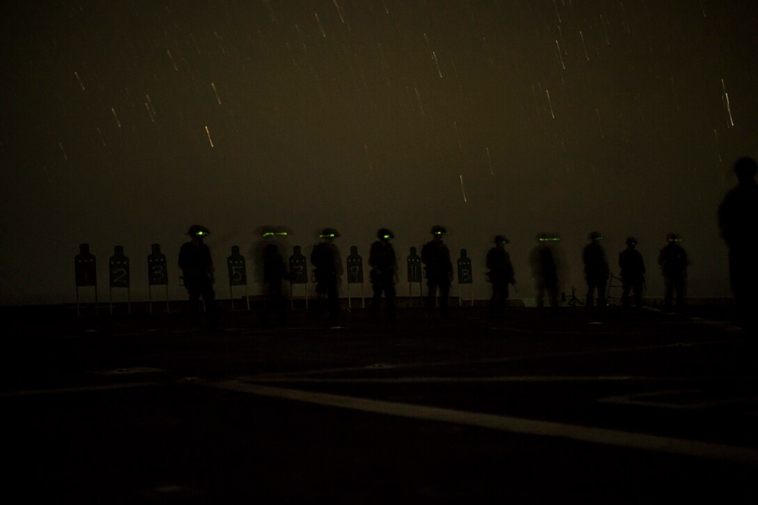 U.S. Marines with Maritime Raid Force, 13th Marine Expeditionary Unit, conduct a deck shoot at night during their Western Pacific Deployment 16 aboard the USS New Orleans, April 1, 2016. More then 4,500 Marines and Sailors from the Boxer ARG, 13th MEU team are currently transiting the Pacific Ocean toward the U.S. 5th fleet area of operations during a scheduled deployment. (U.S. Marine Corps photo by Sgt. Hector de Jesus/RELEASED)