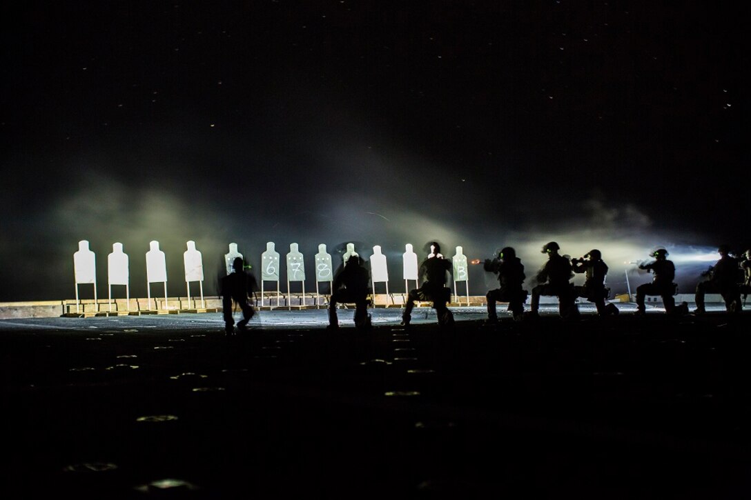 U.S. Marines with Maritime Raid Force, 13th Marine Expeditionary Unit, conduct a deck shoot at night during their Western Pacific Deployment 16 aboard the USS New Orleans, April 1, 2016. More then 4,500 Marines and Sailors from the Boxer ARG, 13th MEU team are currently transiting the Pacific Ocean toward the U.S. 5th fleet area of operations during a scheduled deployment. (U.S. Marine Corps photo by Sgt. Hector de Jesus/RELEASED)