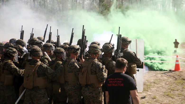 Marines with Combat Logistics Battalion 2 walk down a non-lethal weapons training range during the unit’s non-lethal weapons training final exercise at Marine Corps Base Camp Lejeune, North Carolina, March 25, 2016. The battalion had to qualify through the Expeditionary Operations Training Group in preparation for their upcoming deployment with Special Purpose Marine Air-Ground Task Force-Crisis Response-Africa.