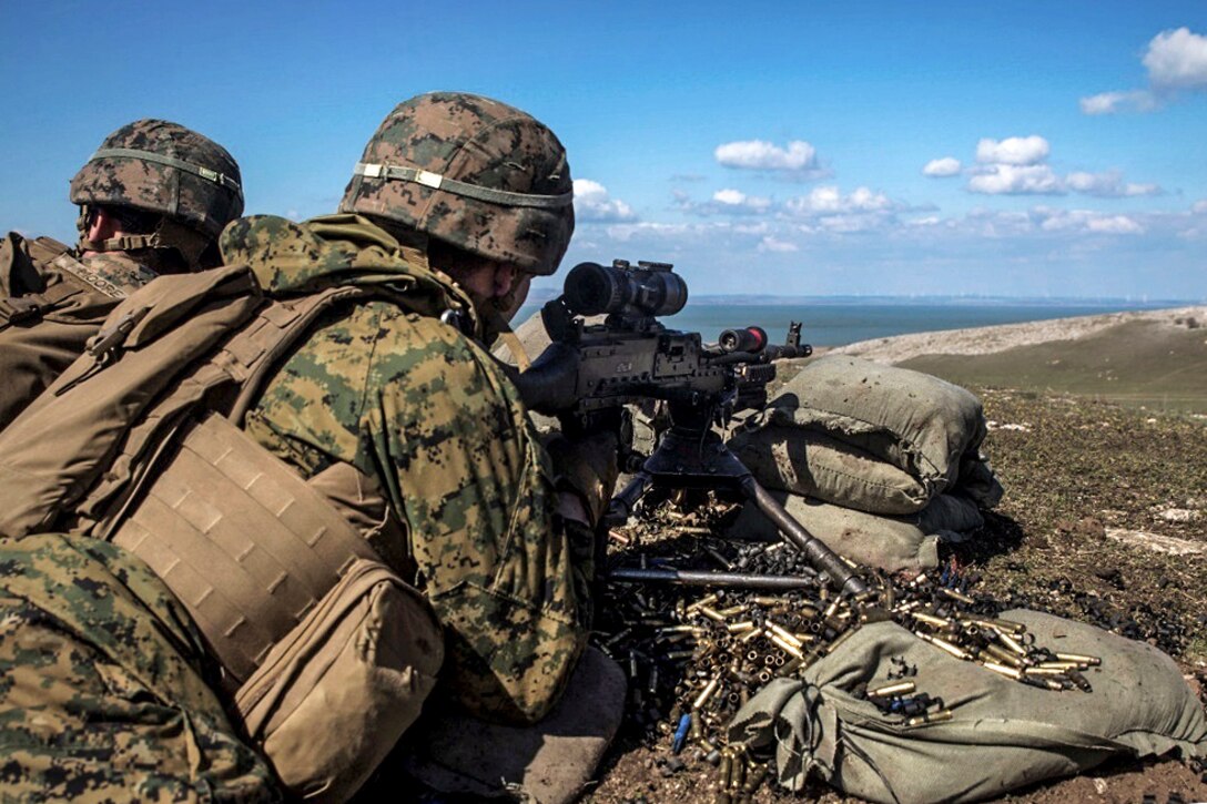 Marines fire an M240 medium machine gun to provide supporting fires for Marines maneuvering through an assault course during Platinum Lynx 16-3 at Babadag Training Area, Romania, March 26, 2016. The exercise aims to build NATO allies’ capabilities, reinforce relationships in a combined-training environment and increase operational proficiencies among U.S., Romanian, Slovenian and Bulgarian forces. Marine Corps photo by Cpl. Tyler A. Andersen