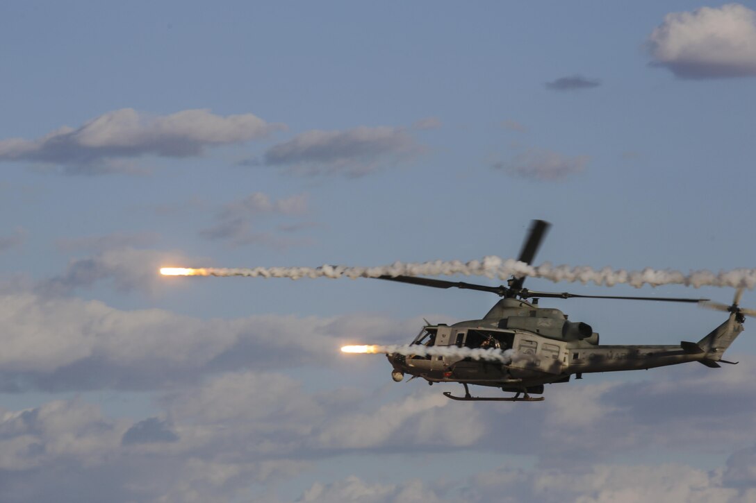A Marine Corps UH-1Y Venom fires rockets during an urban close air support exercise at Yodaville near Yuma, Ariz., April 1, 2016. The Venom is assigned to Marine Aviation Weapons and Tactics Squadron One. The Marines conducted the exercise during an event in part to provide standardized advanced tactical training. Marine Corps photo by Lance Cpl. Zachary M. Ford
