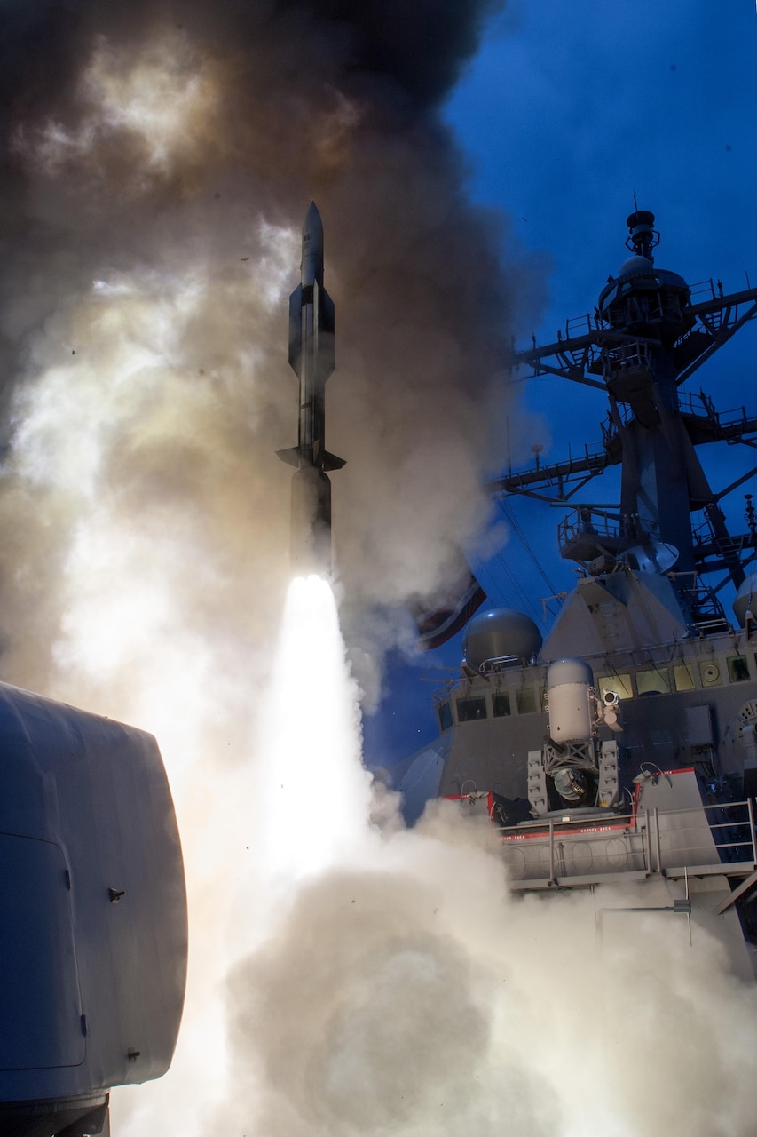 The guided missile destroyer USS John Paul Jones launches a Standard Missile-6 during a live-fire test of the ship's aegis weapons system, June 19, 2014. Over the course of three days, the crew of John Paul Jones successfully engaged six targets, firing a total of five missiles that included four SM-6 models and one SM-2 model. Navy photo
