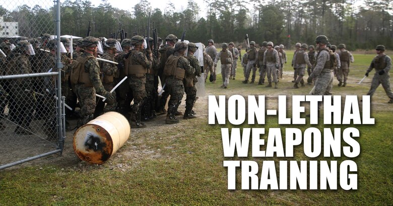 A riot control squad, comprised of Marines with Combat Logistics Battalion 2, faces a notional opposing force during the unit’s non-lethal weapons training final exercise at Camp Lejeune, N.C., March 25, 2016. The battalion had to qualify through the Expeditionary Operations Training Group in preparation for their upcoming deployment with Special Purpose Marine Air-Ground Task Force-Crisis Response-Africa. (U.S. Marine Corps illustration by Cpl. Joey Mendez)