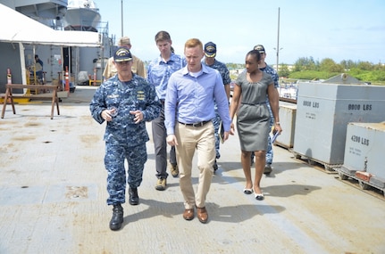 Cmdr. Ed Callahan, executive officer of the Emory S. Land-class submarine tender USS Frank Cable (AS 40), explains shipboard capabilities during a ship's tour to military legislative assistant Alec D. Johnson, March 30. Frank Cable, forward deployed to the island of Guam conducts maintenance and support of submarines and surface vessels deployed to the U.S. 7th Fleet area of responsibility.