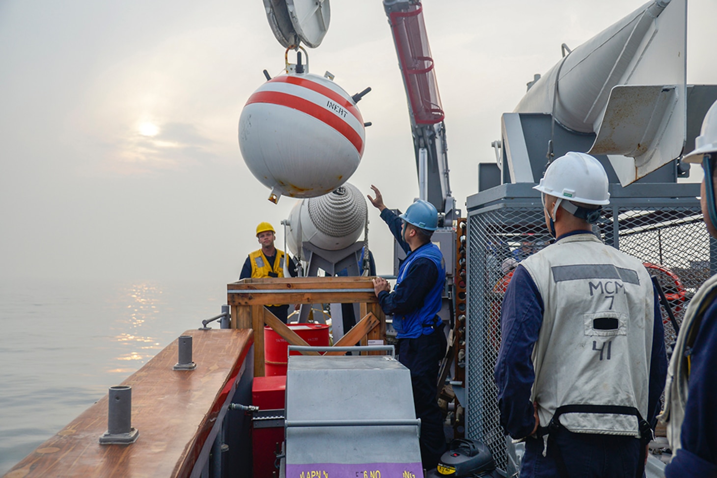 WATERS SURROUNDING THE KOREAN PENINSULA, Republic of Korea (March 31, 2016) Mineman 2nd Class Eric Evans and Mineman Seaman James Nagle help retrieve a training mine aboard the mine countermeasures ship USS Patriot (MCM 7) during exercise Foal Eagle. Foal Eagle is a series of joint and combined field training exercises conducted by Combined Forces Command (CFC) and U.S. Forces Korea (USFK) ground, air, naval and special operations component commands. Approximately 10,600 U.S. forces are operating alongside Republic of Korea forces.