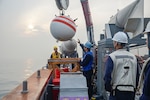 WATERS SURROUNDING THE KOREAN PENINSULA, Republic of Korea (March 31, 2016) Mineman 2nd Class Eric Evans and Mineman Seaman James Nagle help retrieve a training mine aboard the mine countermeasures ship USS Patriot (MCM 7) during exercise Foal Eagle. Foal Eagle is a series of joint and combined field training exercises conducted by Combined Forces Command (CFC) and U.S. Forces Korea (USFK) ground, air, naval and special operations component commands. Approximately 10,600 U.S. forces are operating alongside Republic of Korea forces.