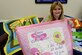 Rhonda Mattice, 4th Equipment Maintenance Squadron secretary, displays a few baby blankets she hand-made for members of her squadron, March 30, 2016, at Seymour Johnson Air Force Base, North Carolina. As part of the Key Spouse program, Mattice put together a committee to make baby blankets for expecting families within her squadron. (U.S. Air Force photo/Airman 1st Class Ashley Williamson)