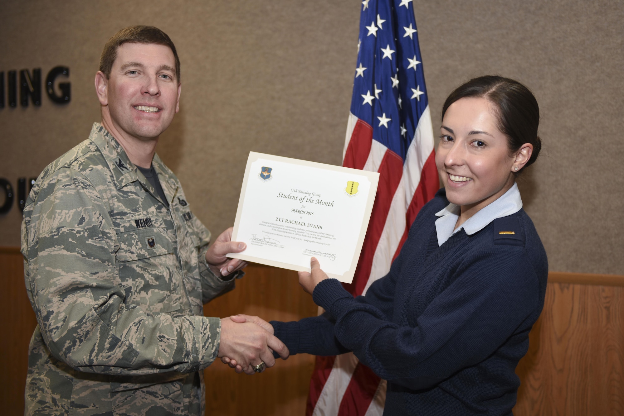 U.S. Air Force Col. Kurt A. Wendt, 17th Training Group Deputy Commander, presents the 315th Training Squadron Officer Student of the Month award for March 2016 to U.S. Air Force 2nd Lt. Rachael Evans at the Brandenburg Hall on Goodfellow Air Force Base, Texas, April 1, 2016. (U.S. Air Force photo by Airman Chase Sousa/Released)