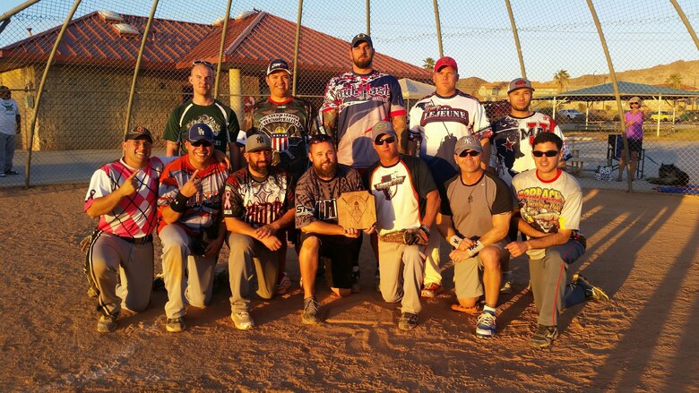 Team Random Jerseys proudly display their plaque after winning the Marine Corps Tactics and Operations Group annual Softball Tournament held at Felix Field, March 26, 2016. (Courtesy Photo)