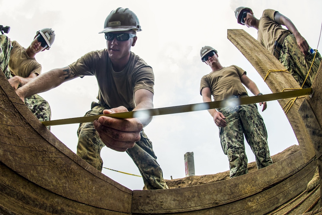 Navy Seabees build a frame into which they will pour concrete as they construct a building in Douala, Cameroon, April 1, 2016. The Seabees are working with sailors on the USNS Spearhead, deployed in U.S. 6th Fleet area of operations to support Africa Partnership Station, an international program. Navy photo by Petty Officer 3rd Class Amy M. Ressler