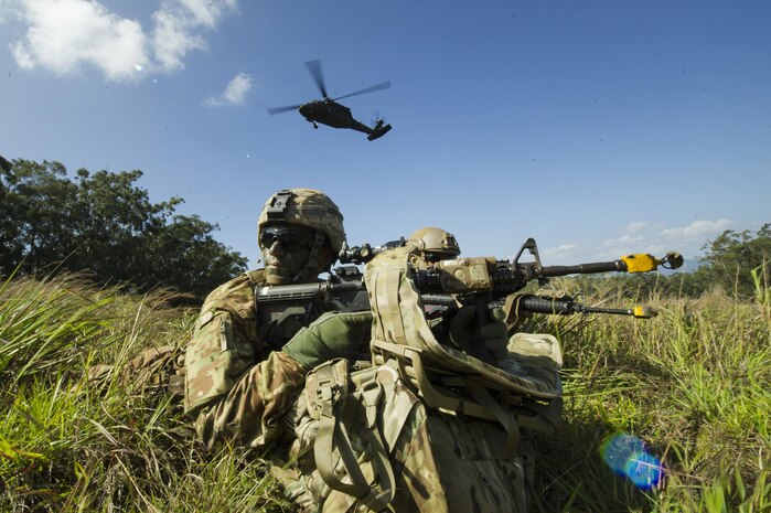 U.S. Army 1st Lt. Joseph Ross, 2nd Platoon, Alpha Company, 29th Engineer Battalion, 3rd Brigade, 25th Infantry Division, provides security after exiting a U.S. Army Black Hawk during a tactical insertion as part of the 25th ID Lightning Academy’s Jungle Operations Training Center (JOTC) patrol day one March 23, 2016, at the East Range Training Center, Hawaii. Students who attend the JOTC training course learn how to operate in a jungle environment learning skills focused on survival, communication, navigation, waterborne and patrol base operations. Ross grew up in York, Pennsylvania and attributes stories he heard from his grandfather, a World War II veteran, in his decision to join the military. 