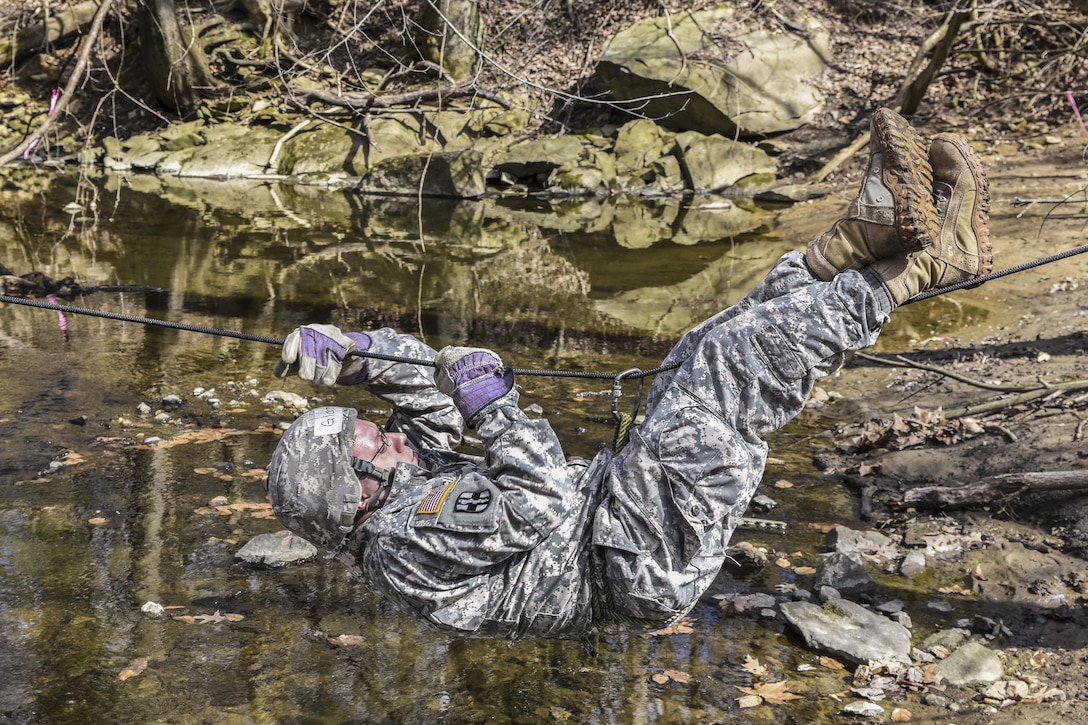 A medical student from the Uniformed Services University of the Health Sciences perform field exercise drills during Operation Gunpowder at Naval Support Activity Bethesda in Bethesda, Md., March 21, 2016. Navy photo by Seaman Matthew Hobso