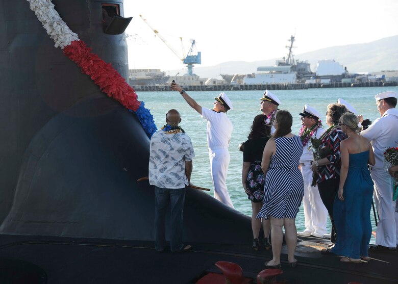 141125-N-DB801-373
PEARL HARBOR, Hawaii (Nov. 25, 2014) Capt. Harry Ganteaume, commodore of Submarine Squadron (SUBRON) 1, participates in a traditional Hawaiian blessing ceremony of the Virginia-class attack submarine USS Mississippi (SSN 782) upon the ship's arrival at Joint Base Pearl Harbor-Hickam. Mississippi is changing homeport from Commander, Submarine Squadron 4 in Groton, Conn. to Commander, Submarine Squadron 1. Mississippi makes is the 4th Virginia-class submarine to be home ported in Pearl Harbor, and one of 18 attack submarines permanently homeported at the historic base. (U.S. Navy photo by Mass Communication Specialist 1st Class Steven Khor/Released)                               