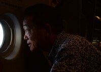 A member of the Friends of Hickam looks out the window of a C-17 Globmaster III during a training sortie near Joint Base Pearl Harbor-Hickam, March 31, 2016. The flight was a portion of a base tour that highlighted some of the 15th Wing’s agencies including Security Forces, Explosive Ordnance Disposal, Maintenance Group and the 15th Medical Group. The Friends of Hickam serve as facilitators between the 15th Wing command and the Hawaii community. The purpose of the Friends of Hickam is to provide public support for the U.S. Air Force in Hawaii and its missions. They also help to improve the quality of life for Air Force personnel and their families. (U.S. Air Force photo by Tech. Sgt. Aaron Oelrich/released) 