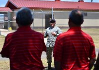 Staff Sgt. Matthew Zantene, a 647th Security Forces Squadron military working dog handler, briefs members of the Friends of Hickam during a tour of Joint Baser Pearl Harbor-Hickam, March 31, 2016. The tour highlighted some of the 15th Wings agencies including Security Forces, Explosive Ordines Disposal, Maintenances and the 15th Medical Group. The Friends of Hickam serve as facilitators between the 15th Wing command and the Hawaii community. The purpose of the Friends of Hickam is to provide public support for the U.S. Air Force in Hawaii and its missions. They also help to improve the quality of life for Air Force personnel and their families. (U.S. Air Force photo by Tech. Sgt. Aaron Oelrich/released) 