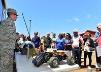 Senor Airman Eric McKinley, 647th Civil Engineer Squadron explosive ordnance disposal flight, briefs members of the Friends of Hickam during a tour of Joint Base Pearl Harbor-Hickam, March 31, 2016. The tour highlighted some of the 15th Wings agencies including Security Forces, Explosive Ordines Disposal, Maintenances and the 15th Medical Group. The Friends of Hickam serve as facilitators between the 15th Wing command and the Hawaii community. The purpose of the Friends of Hickam is to provide public support for the U.S. Air Force in Hawaii and its missions. They also help to improve the quality of life for Air Force personnel and their families. (U.S. Air Force photo by Tech. Sgt. Aaron Oelrich/released) 