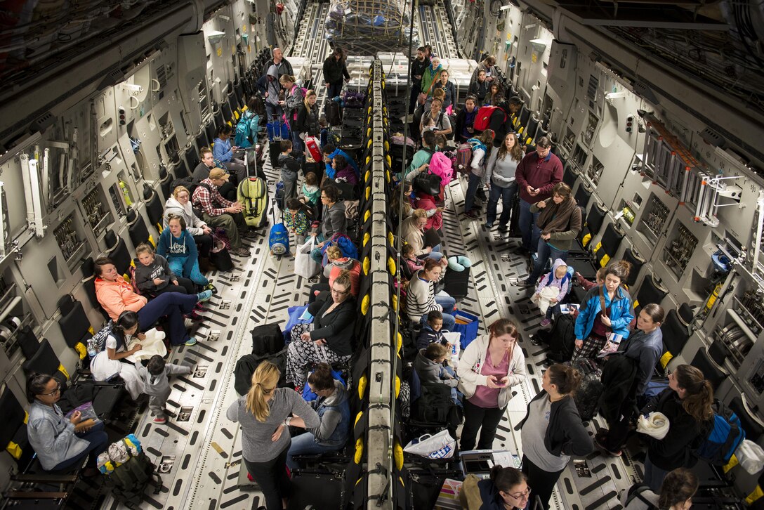 Dependents of military members from Incirlik Air Base, Turkey, wait to disembark from a C-17 Globemaster III after landing at Baltimore Washington International Airport, Md., April 1, 2016. Defense Department dependents in Adana, Izmir and Mugla, Turkey, were given an ordered departure by the State Department and Secretary of Defense. (U.S. Air Force photo/Staff Sgt. Andrew Lee)
