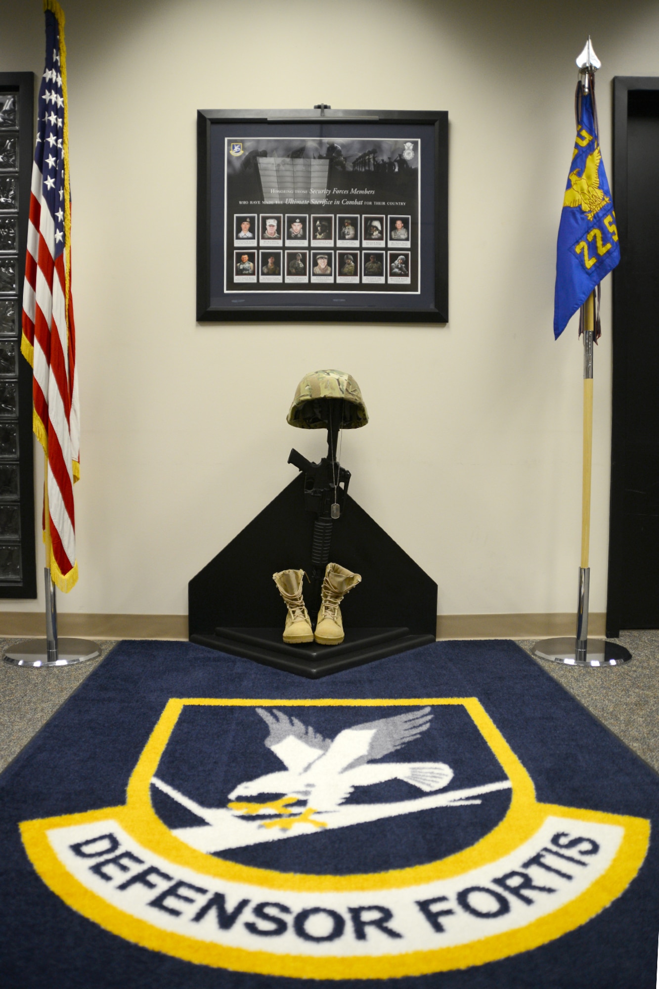 Defenders from the 22nd Security Forces Squadron honored their fallen brothers and sisters by revealing a memorial, March 29, 2016, at McConnell Air Force Base, Kan. The memorial honors all security forces members who have lost their lives in the line of duty since Vietnam. In 2015, four defenders lost their lives and the memorial needed to be updated with their names. (U.S. Air Force photo/Airman 1st Class Christopher Thornbury)