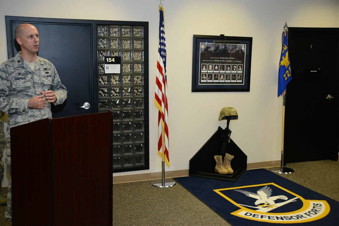 Maj. Trenton Shepherd, 184th Security Forces Squadron commander, speaks during the Security Forces Fallen Heroes Memorial, March 29, 2016, at McConnell Air Force Base, Kan. Shepherd spoke of the brotherhood security forces Airmen share with each other and how the loss of a defender from a different unit still affects all units. (U.S. Air Force photo/Airman 1st Class Christopher Thornbury)