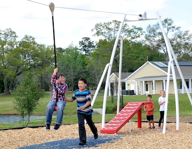 Kids from the Joint Base Charleston community use the zip line in JB Charleston’s new playground, on Touhey Boulevard, March 28, 2016. The playground is open to base residents every day from 8 a.m. to sunset. (U.S. Air Force photo/Airman Megan Munoz)