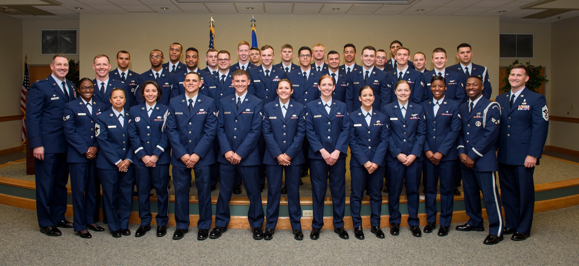 (Left) Col. Robert Lyman, Joint Base Charleston commander, (third from left) Lt. Col. Joseph Thomas, 628th Force Support Squadron commander, (fourth from left) Chief Master Sgt. Debra Mosley, 628th FSS superintendent, and (right) Chief Master Sgt. Mark Bronson, 628th ABW command chief, stand with JB Charleston Honor Guard Class 16A graduates Apr. 1, 2016, at Joint Base Charleston – Air Base, S.C. These Airmen completed a grueling two-week course in which they learned pall-bearing maneuvers, flag folding sequences, basic drill and ceremony movements and firing party procedures. (U.S. Air Force photo/Senior Airman Clayton Cupit)