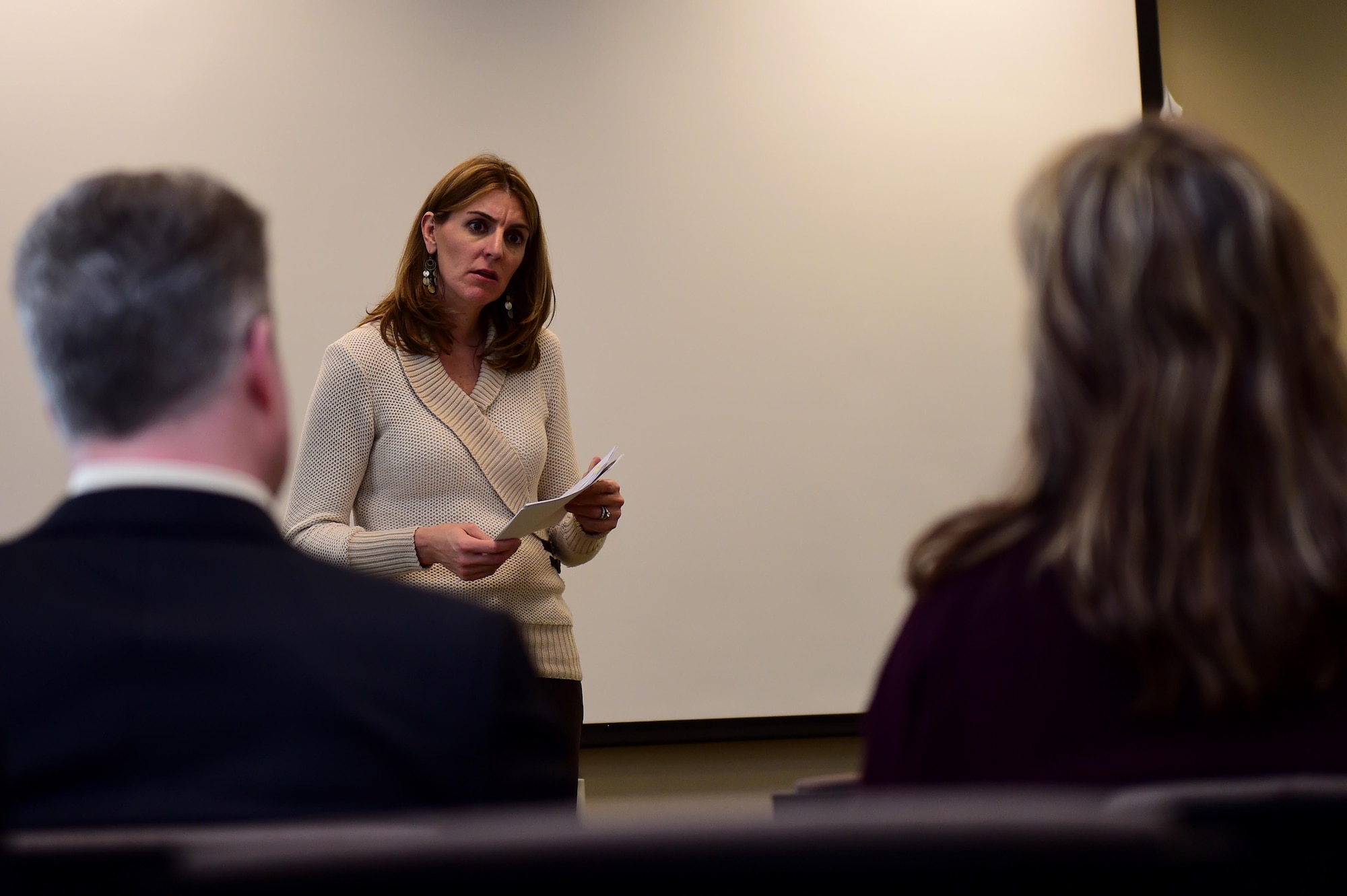 Christina Grooms, 460th Space Wing community support coordinator, listens to Team Buckley members March 28, 2016, during a Caring for People forum at Chapel on Buckley Air Force Base, Colo. The forum provided Team Buckley with an opportunity to discuss topics of concern and share opinions about the local community. (U.S. Air Force photo by Airman 1st Class Gabrielle Spradling/Released)