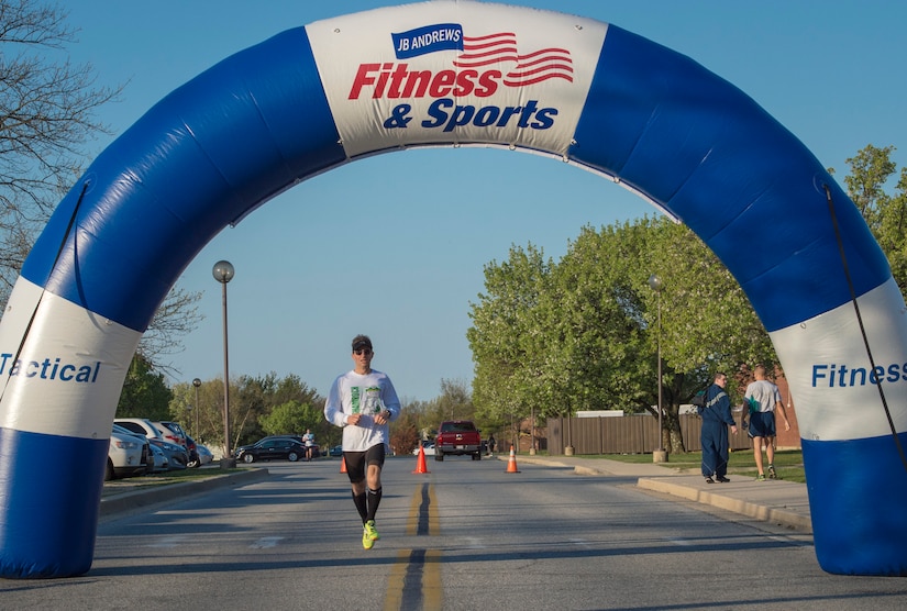 Chris Zabriski, 5k participant, was the first male finisher of the second annual “Consent to Color” 5k on Joint Base Andrews, Md., April 4, 2016. Zabriski finished with a time of 21 minutes and 11 seconds. (U.S. Air Force photo by Senior Airman Ryan J. Sonnier/RELEASED)