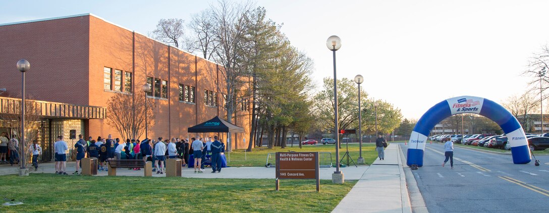 Joint Base Andrews members gather outside the West Fitness Center before a 5k run here, April 4, 2016. The second annual “Consent to Color” run was held for Sexual Assault Awareness month. (U.S. Air Force photo by Senior Airman Ryan J. Sonnier/RELEASED)