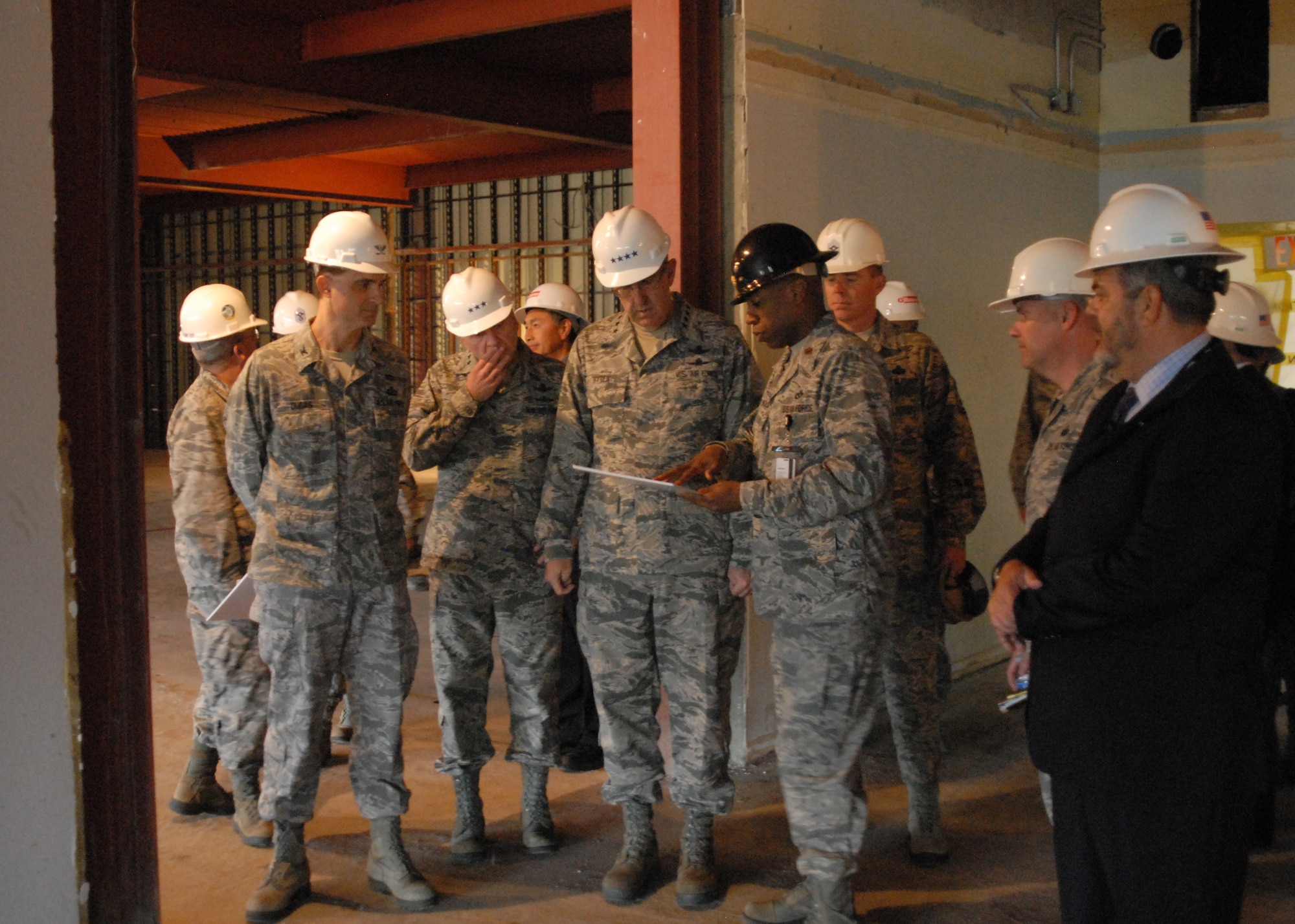 Maj. Kelvin  Haywood, deputy project management officer, 14th Air Force (Air Forces Strategic), briefs General John Hyten, Air Force Space Command commander and Lt. Gen. David  Buck, 14th AF (AFSTRAT) and Joint Functional Component Command for Space commander, on plans for the Joint Space Operations Center and 14th AF (AFSTRAT), JFCC Space Headquarters Consolidation Project March 28, 2016 at Vandenberg Air Force Base, California. The project will resolve ongoing power and infrastructure deficiencies in the current home of the JSpOC, providing a more stable mission platform, and geographically co-locate the 14th AF (AFSTRAT) and JFCC Space Commander and his staff with the JSpOC, bringing all the mission functions together under one roof.  (U.S. Air Force photo by Capt. Nicholas Mercurio/Released)