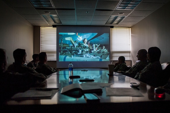 Members of the 314th Aircraft Maintenance Squadron watch the Profession of Arms Center of Excellence video March 23, 2016, on Little Rock Air Force Base, Ark. The PACE program is an option for U.S. Air Force members to become the best possible leaders. (U.S. Air Force photo by Senior Airman Stephanie Serrano)