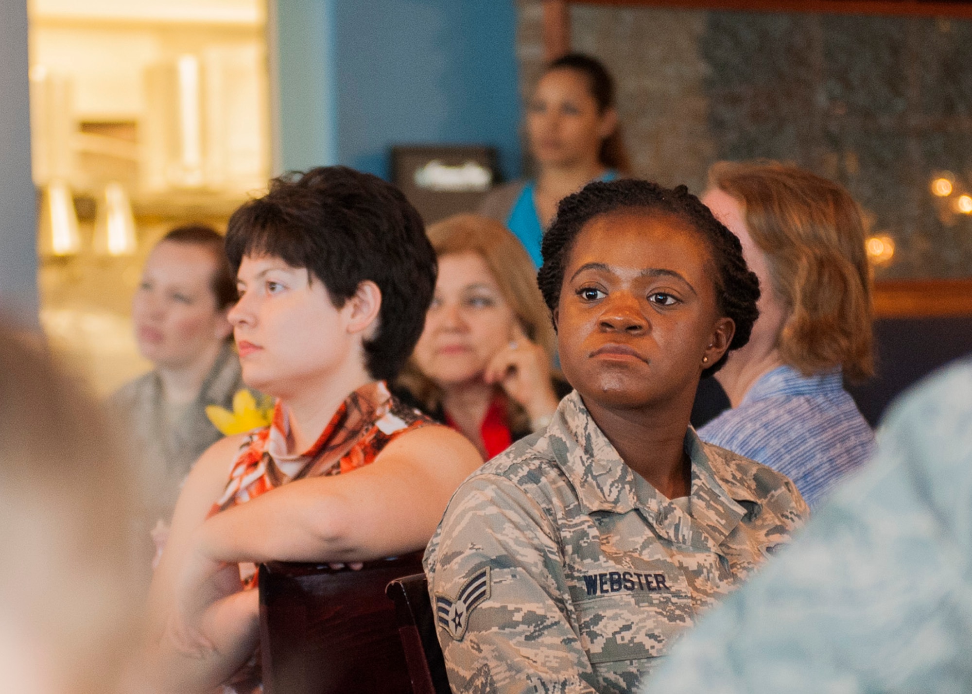 Women's History Month luncheon attendees listen to Lt. Col. Christine Mau, 33rd Operations Group deputy commander, share her career and life experiences leading up to her becoming the Air Force's first female F-35 pilot during the annual event March 31 in Valparaiso, Fla. (U.S. Air Force photo/Ilka Cole)