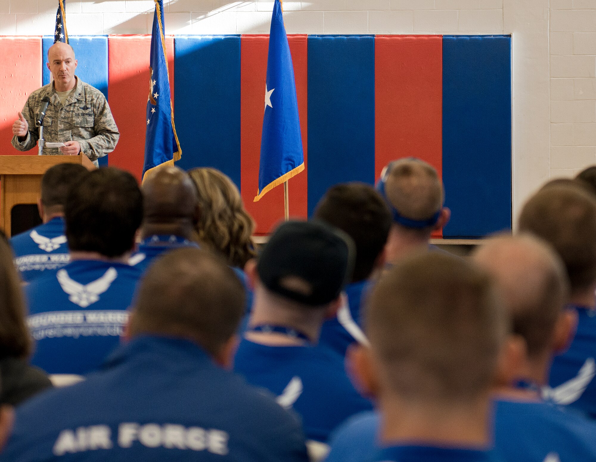 Brig. Gen. Christopher Azzano, the 96th Test Wing commander, speaks to the Warrior CARE attendees and Warrior Games athletes at the opening ceremony of the two events April 4 at Eglin Air Force Base, Fla.  The ceremony kicked off a week-long rehabilitative wounded warrior camp as well as a training session for the Air Force Warrior Games athletes.  (U.S. Air Force photo/Samuel King Jr.)