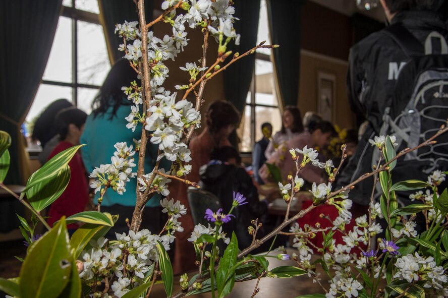 Attendees of the 29th Annual Japan Day arrange flowers at Misawa Air Base, Japan, April 2, 2016. Hundreds of base residents attended Japan Day to absorb various forms of Japanese culture. (U.S. Air Force photo by Airman 1st Class Jordyn Fetter)