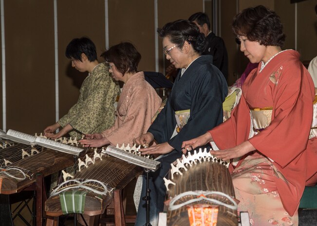 Performers play kotos, traditional Japanese instruments, at the 29th Annual Japan Day at Misawa Air Base, Japan, April 2, 2016. The musicians, along with other volunteers, showed their skill by playing instruments like the koto, flutes and the popular taiko drums. (U.S. Air Force photo by Airman 1st Class Jordyn Fetter)